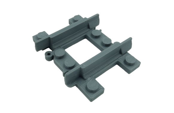 3D printed LEGO train compatible quarter straight narrow gauge track.